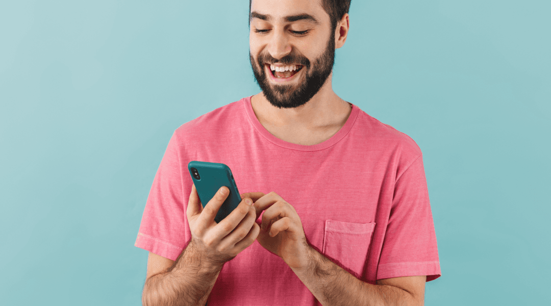Man using phone and looking happy