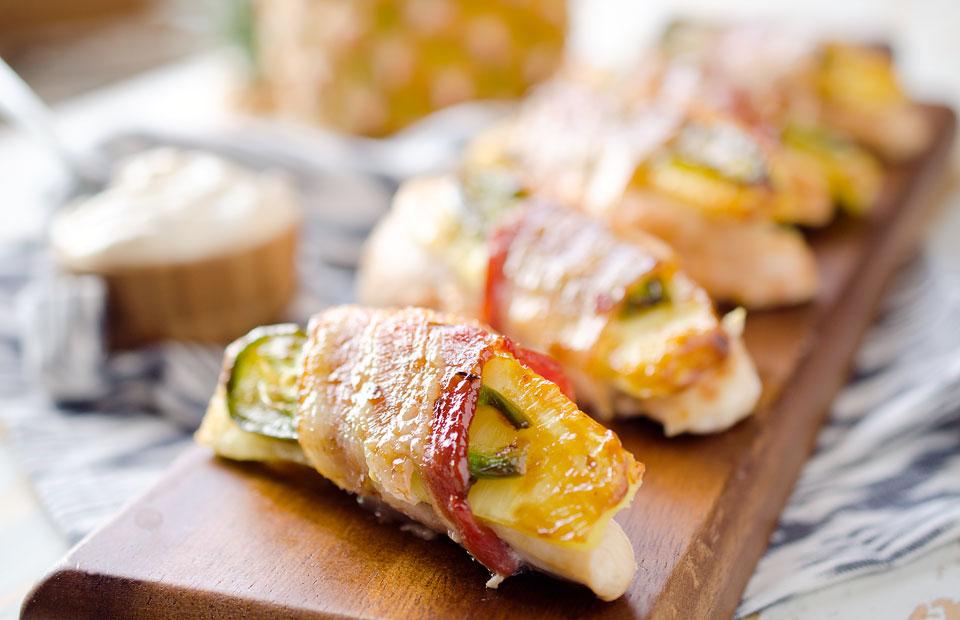 roasted jalapeno pineapple chicken tenders laid out on a board
